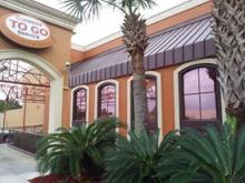 Photo of Solar Gard Solar Bronze window tinting installed on a restaurant