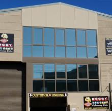 Photo of Solar Gard Stainless Steel window tinting installed on a commercial building